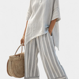 Daisy Szett Aszimmetrikus Pólóval és Csíkos Nadrággal a Modern és Elegáns Stílusért